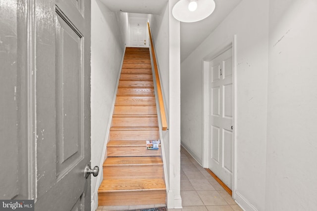 staircase with tile patterned floors