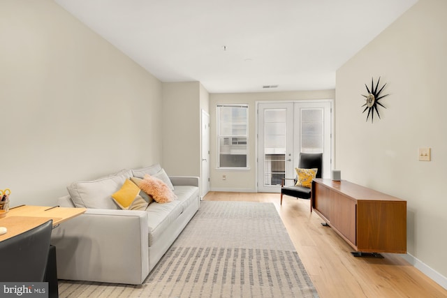 living room with light hardwood / wood-style flooring