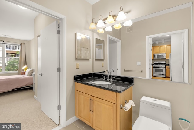 bathroom with vanity and toilet