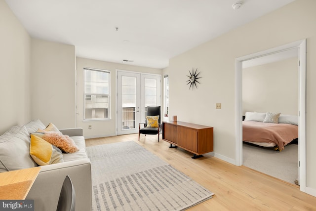 bedroom featuring light hardwood / wood-style flooring and access to exterior