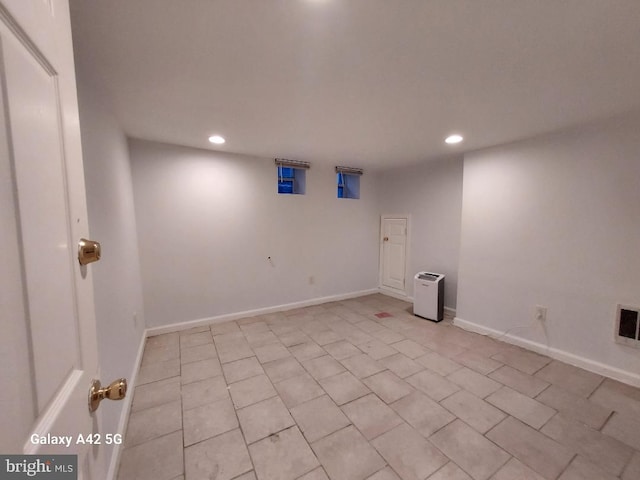 unfurnished room with light tile patterned floors