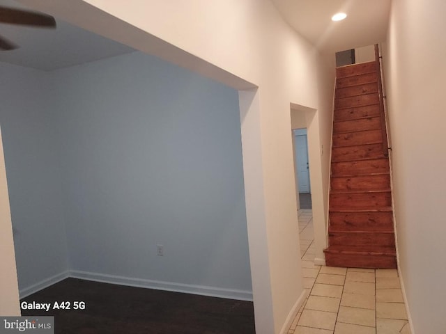 hallway featuring light tile patterned flooring