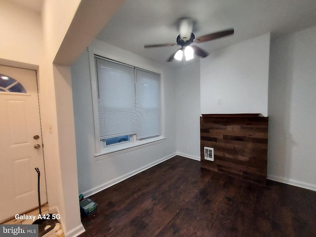 foyer with ceiling fan and dark hardwood / wood-style floors