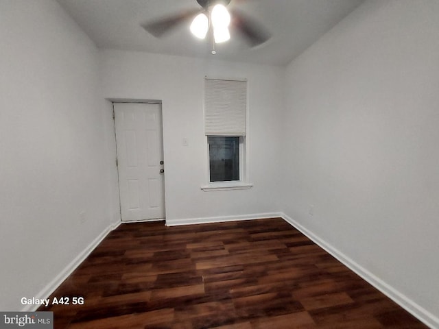 unfurnished room featuring ceiling fan and dark hardwood / wood-style floors