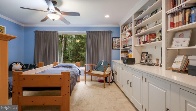 bedroom featuring light carpet, ornamental molding, and ceiling fan