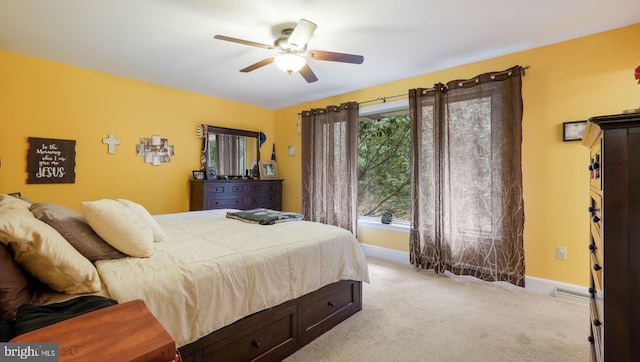 carpeted bedroom featuring ceiling fan