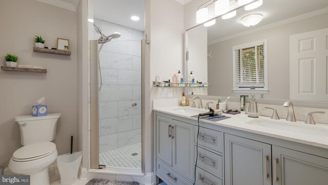 bathroom featuring a tile shower, tile patterned flooring, crown molding, vanity, and toilet