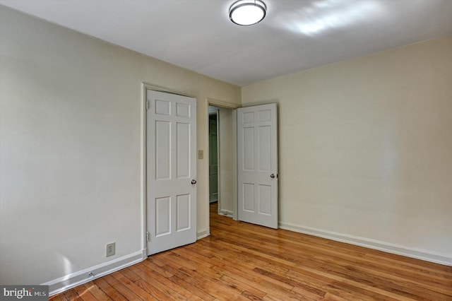 unfurnished bedroom with light wood-type flooring