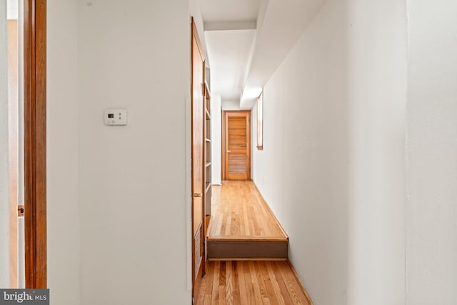 hall with light hardwood / wood-style floors