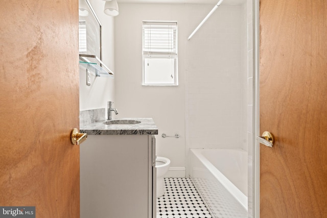 full bathroom with tile patterned flooring, shower / washtub combination, vanity, and toilet