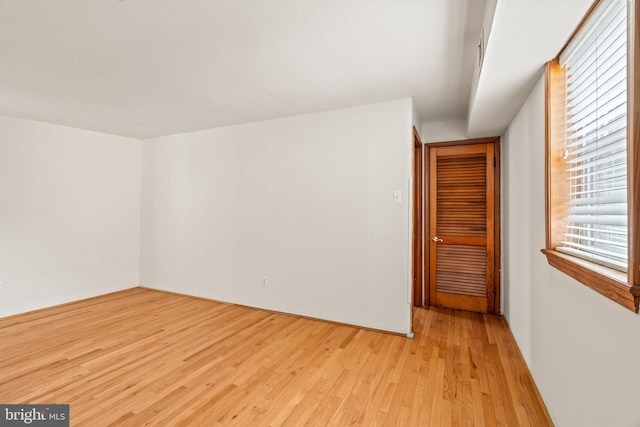 unfurnished room featuring light wood-type flooring