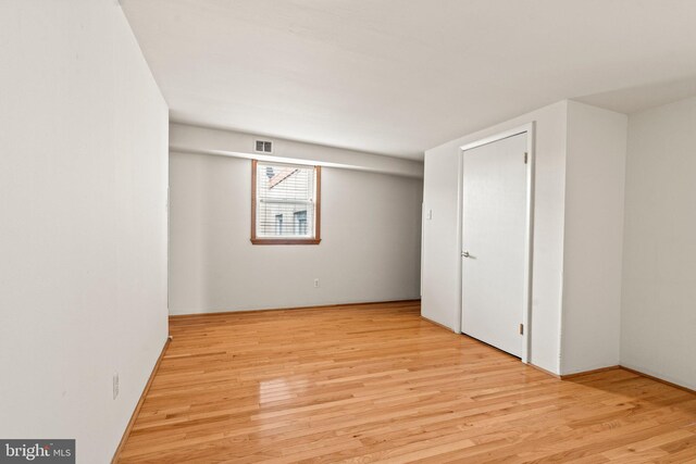 basement with light hardwood / wood-style floors