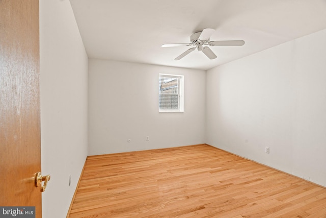 spare room with ceiling fan and light hardwood / wood-style flooring