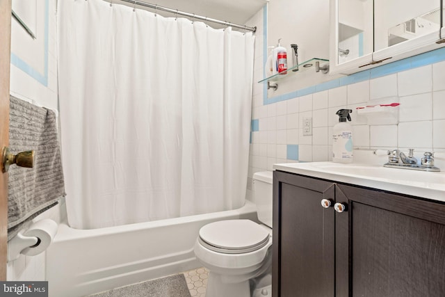 full bathroom with tile walls, shower / tub combo, decorative backsplash, vanity, and toilet