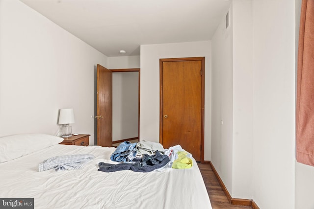 bedroom featuring dark wood-type flooring