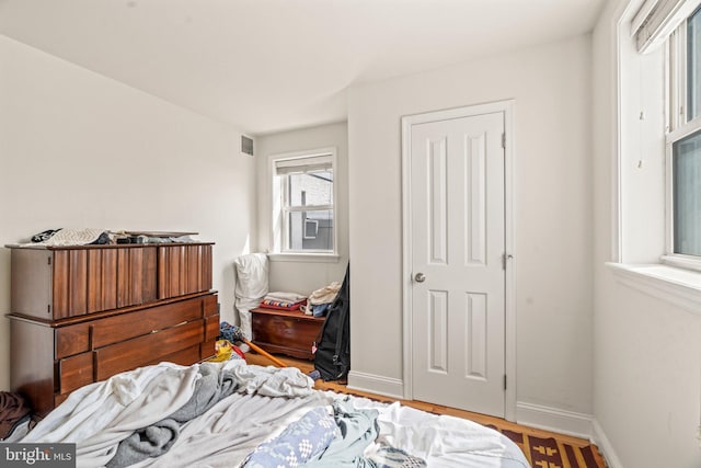 bedroom featuring hardwood / wood-style flooring