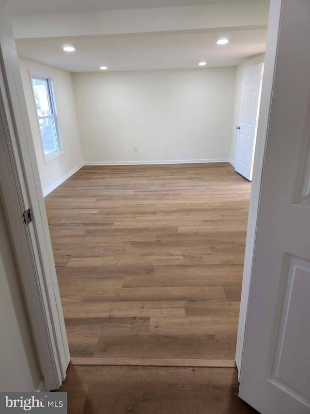 spare room featuring wood-type flooring