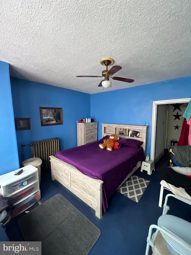 bedroom featuring ceiling fan, a textured ceiling, and billiards