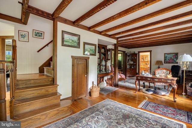 foyer featuring beam ceiling and hardwood / wood-style flooring