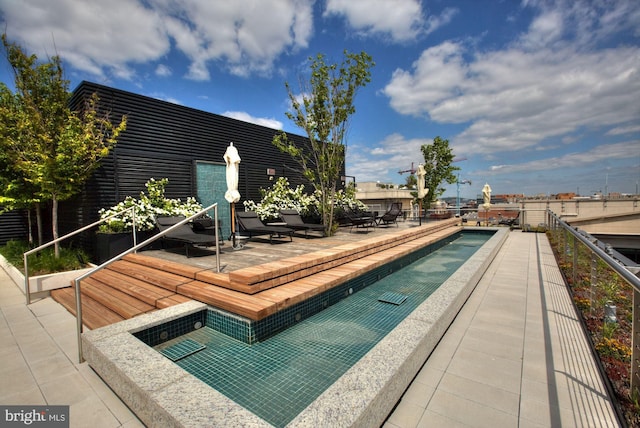 view of swimming pool with a patio