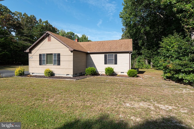 ranch-style house with a front lawn