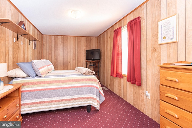 bedroom with wood walls