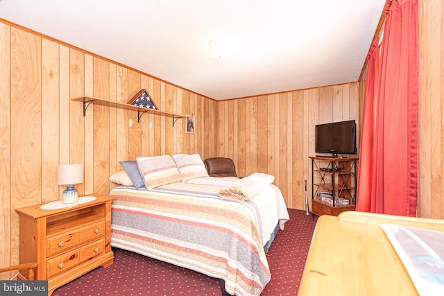 bedroom with wood walls