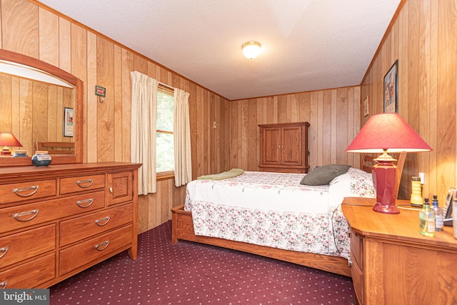 bedroom with wooden walls and a textured ceiling