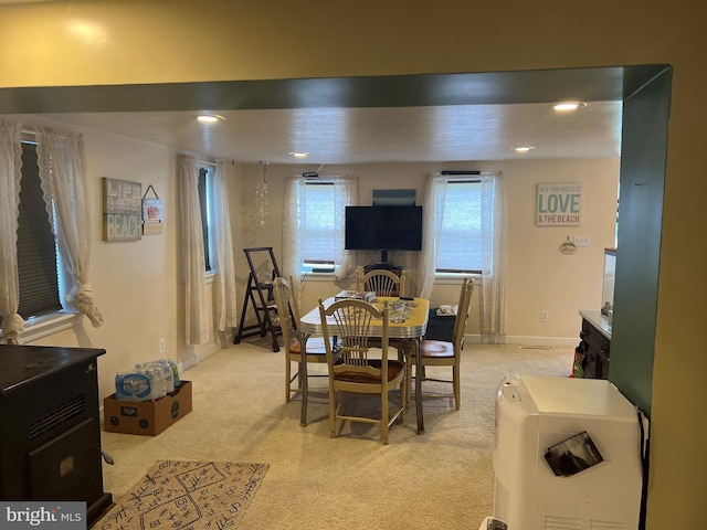 view of carpeted dining space