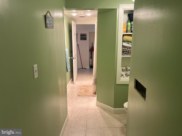 corridor featuring light tile patterned flooring