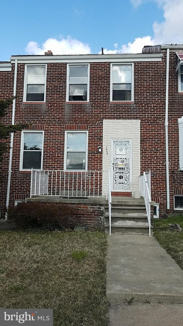 view of front of house with brick siding