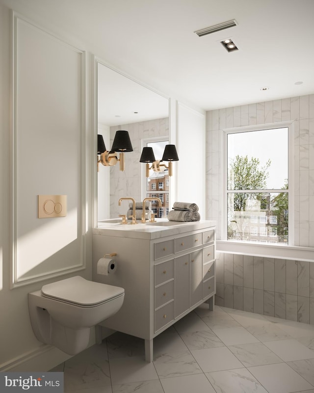 bathroom with vanity and toilet