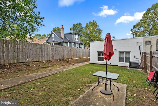 view of yard featuring central AC