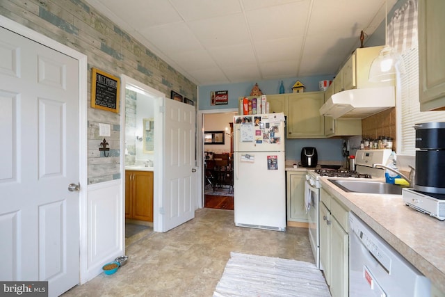 kitchen featuring ventilation hood, white appliances, and sink