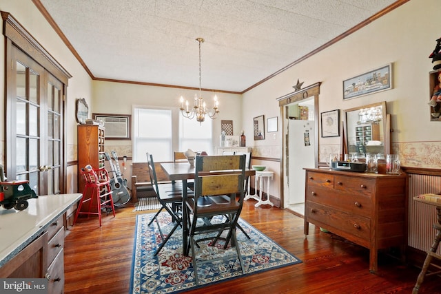 dining room with a textured ceiling and dark hardwood / wood-style flooring