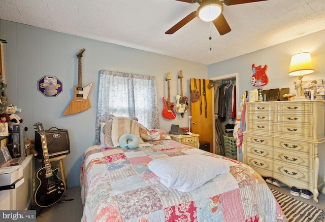 carpeted bedroom featuring a closet and ceiling fan