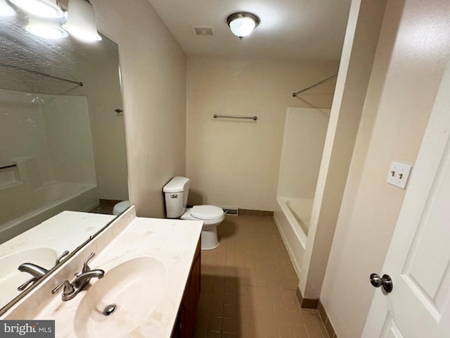 full bathroom with shower / bathing tub combination, tile patterned floors, vanity, and toilet