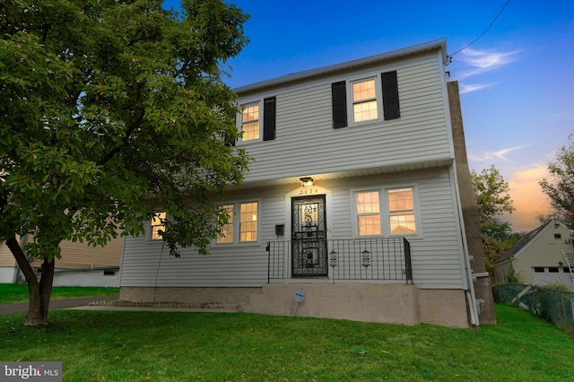 view of front of house with a lawn