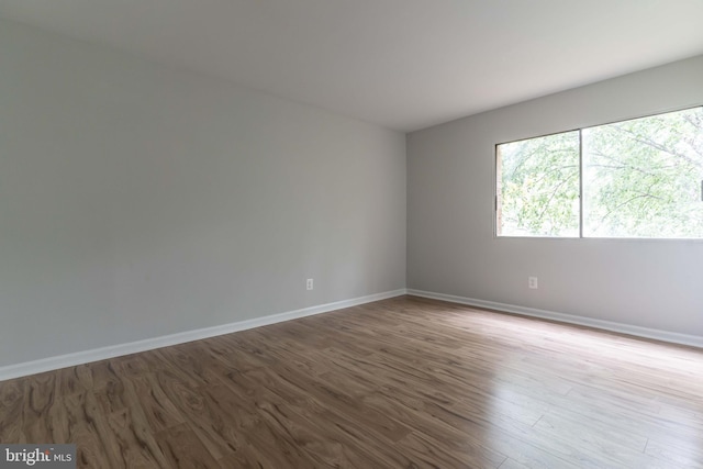 spare room featuring light hardwood / wood-style flooring