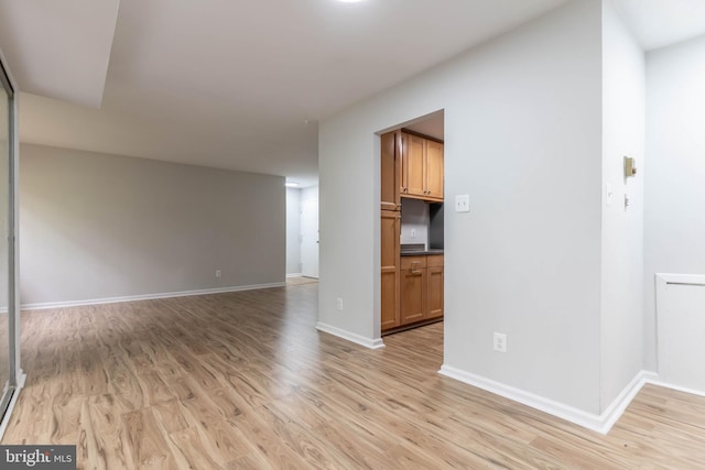 unfurnished living room featuring light hardwood / wood-style floors