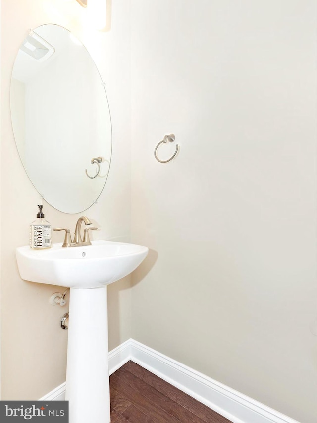 bathroom featuring hardwood / wood-style flooring