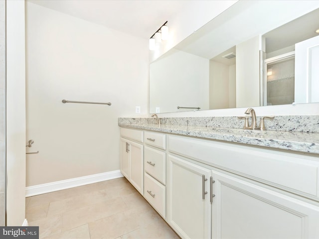 bathroom featuring tile patterned floors and vanity