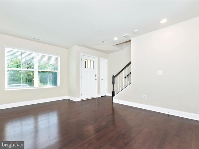 interior space with dark hardwood / wood-style floors