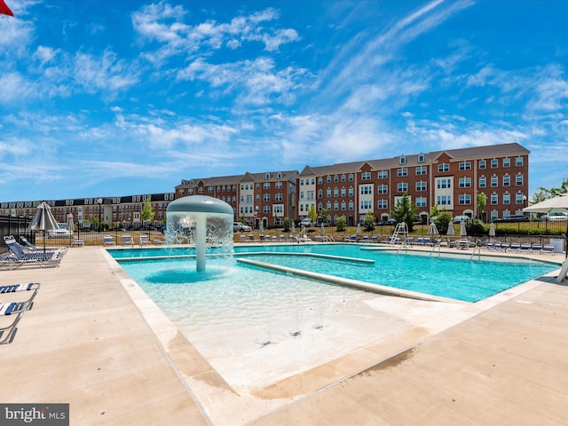 view of pool featuring pool water feature