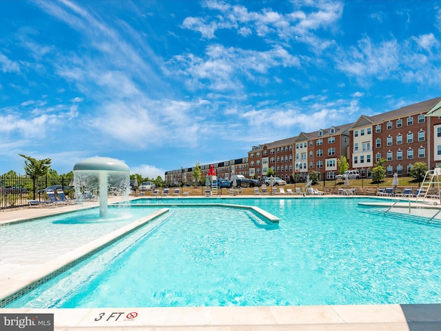 view of pool with pool water feature