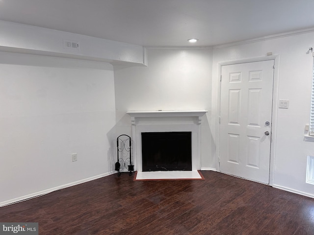 unfurnished living room featuring dark wood-type flooring