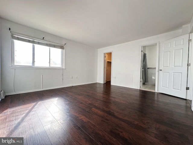 unfurnished room featuring dark hardwood / wood-style floors