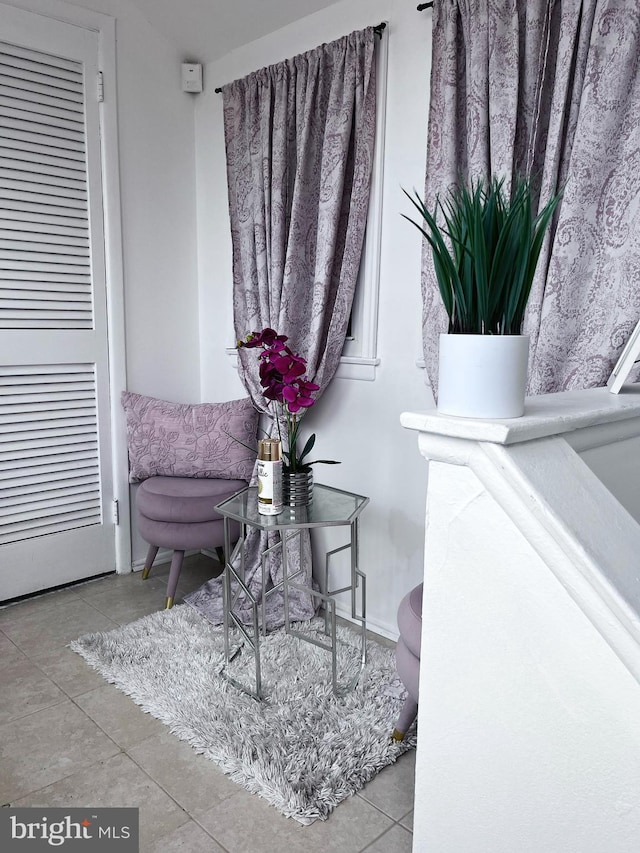 living area featuring tile patterned floors