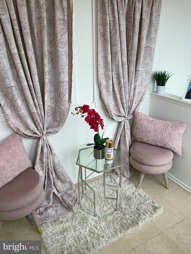 sitting room featuring light tile patterned flooring