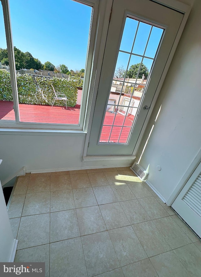 interior space featuring light tile patterned flooring